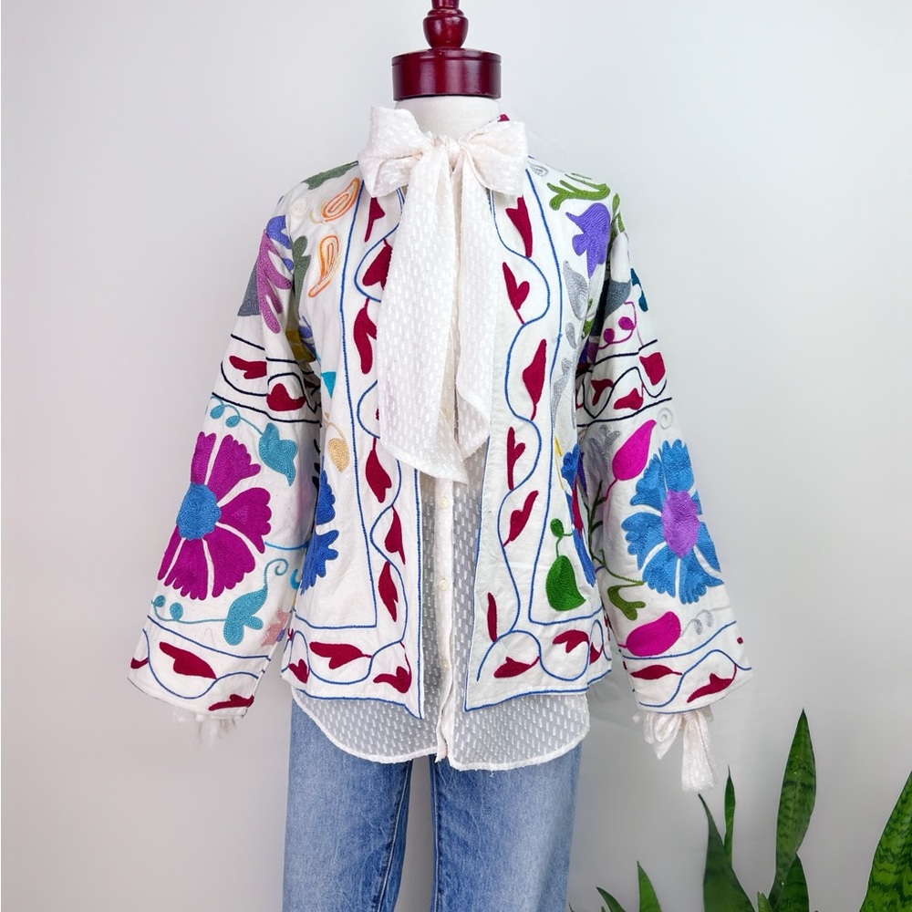 Beautiful bohemian jacket with colorful embroidered details, and cotton lining.